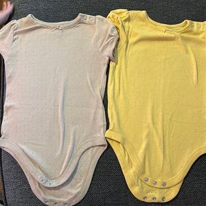 Two bodysuits never worn
